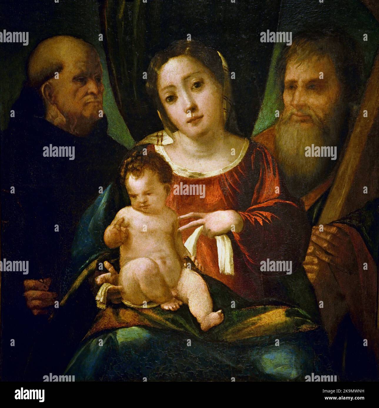 Madonna and Child with Saint Benedict and Saint Andrew 1515 by  Giovanni de' Luteri, called, Dosso Dossi ( 1489 - 1542 Ferrara) Italy, Italian. Stock Photo