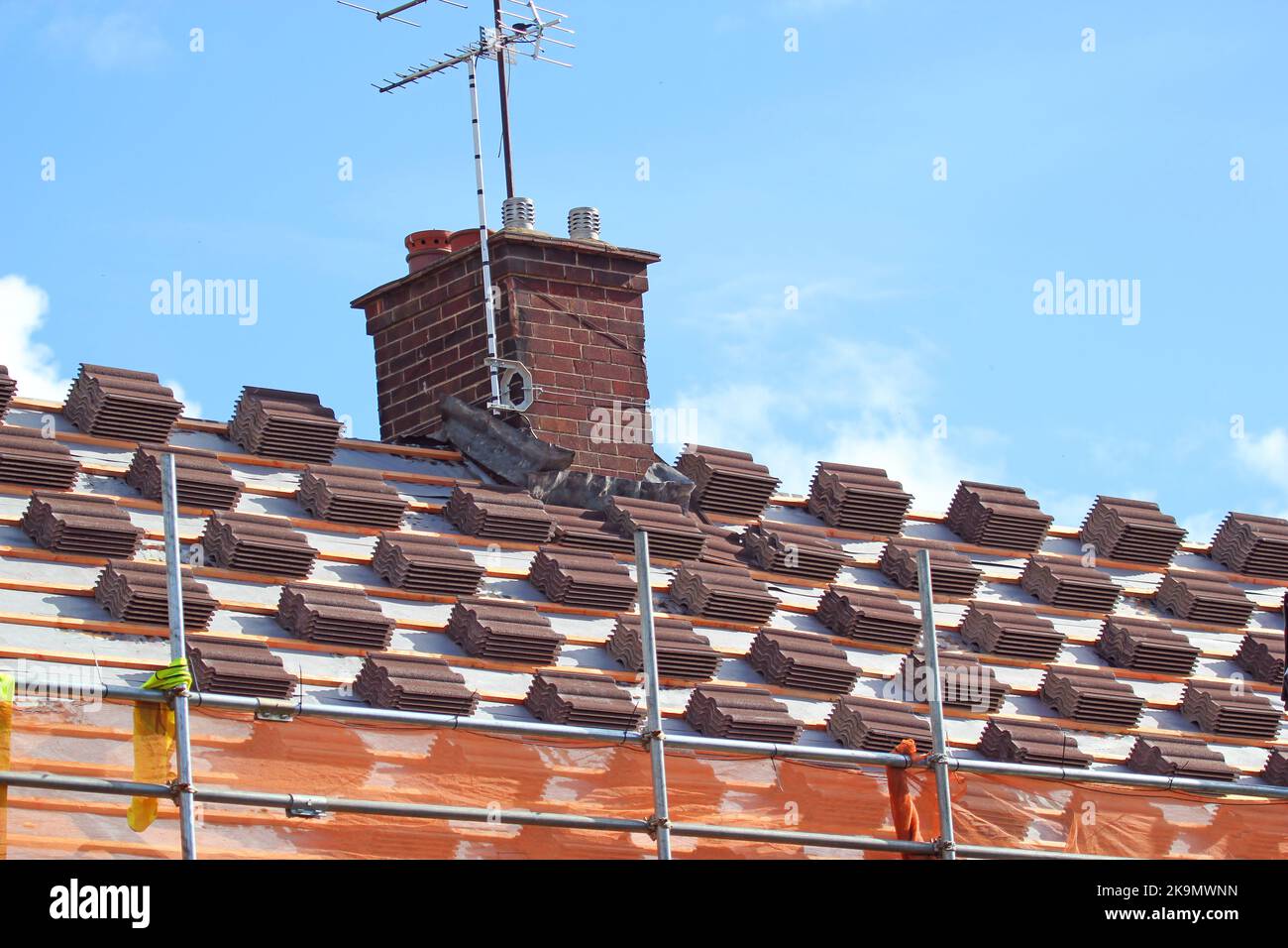 Workers on town house roof removing old slates / no safety equipment or  helmets - France Stock Photo - Alamy