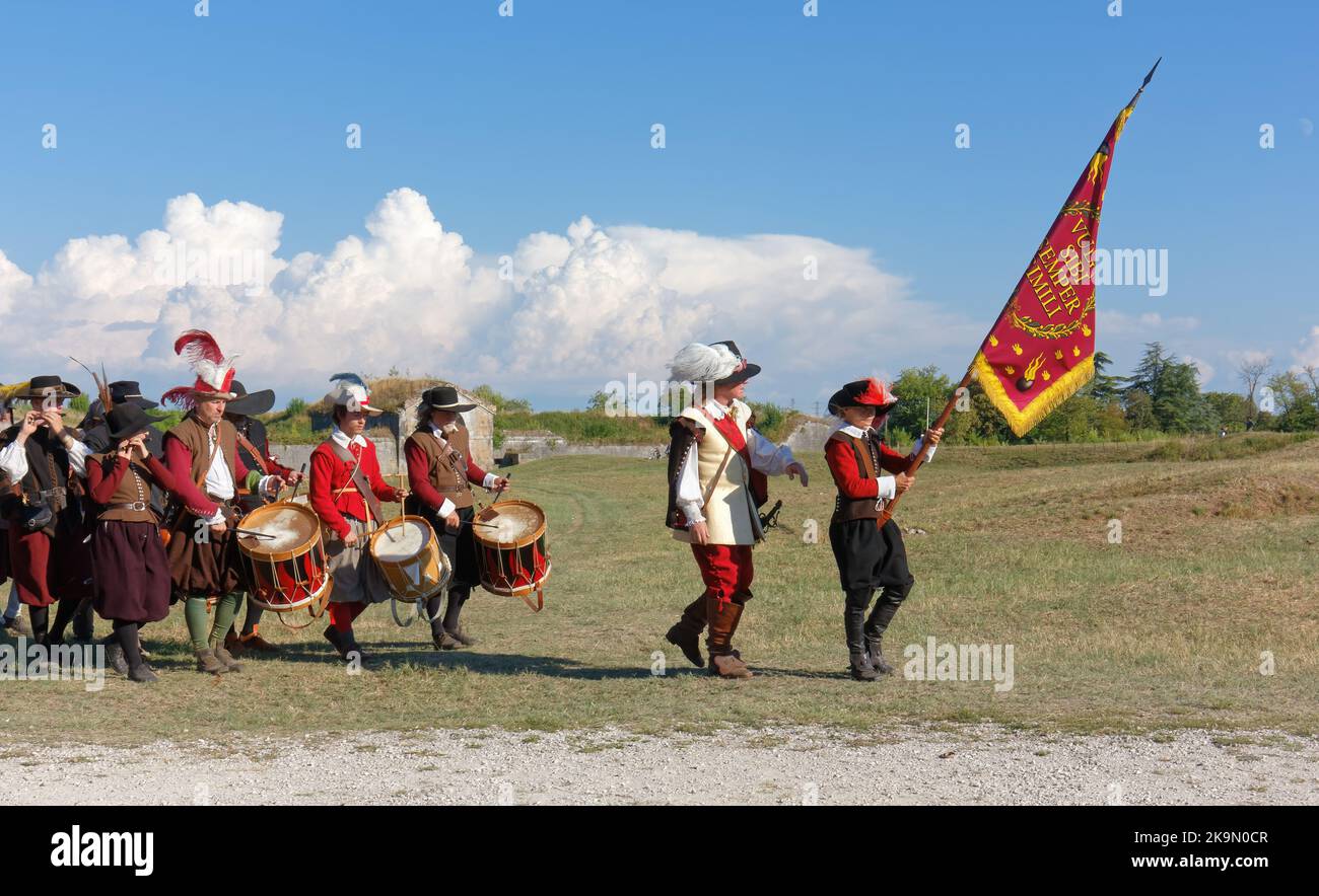 PALMANOVA, Italy - September 4, 2022: Reenactors parading after the battle during the Seventeenth Century annual historical reenactment Stock Photo