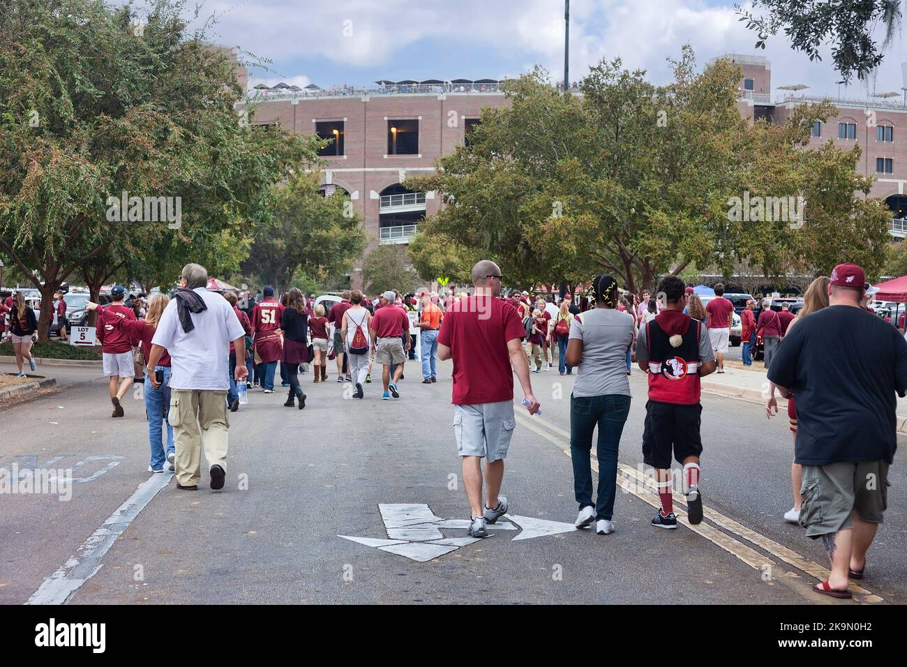 Tallahassee, Florida - November 16, 2013: Fans walking towards Doak Campbell Stadium to watch a Florida State University football game with the FSU Se Stock Photo