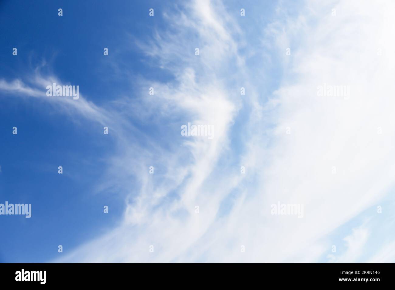White cirro-cumulus clouds in soft blue sky Stock Photo