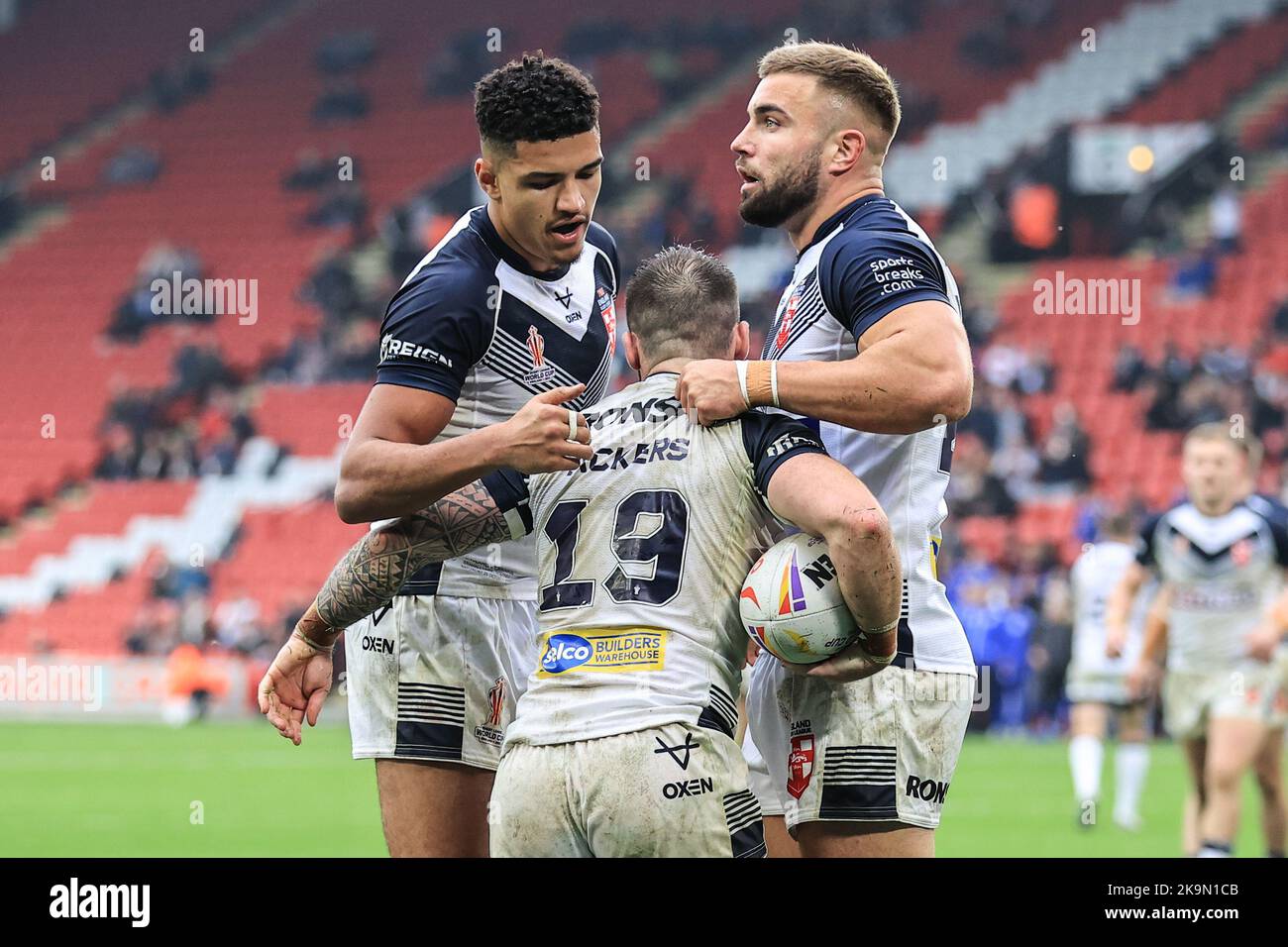 Andy Ackers of England celebrates his try with Kai Pearce-Paul of England and Mike McMeeken of England during the Rugby League World Cup 2021 match England vs Greece at Bramall Lane, Sheffield,