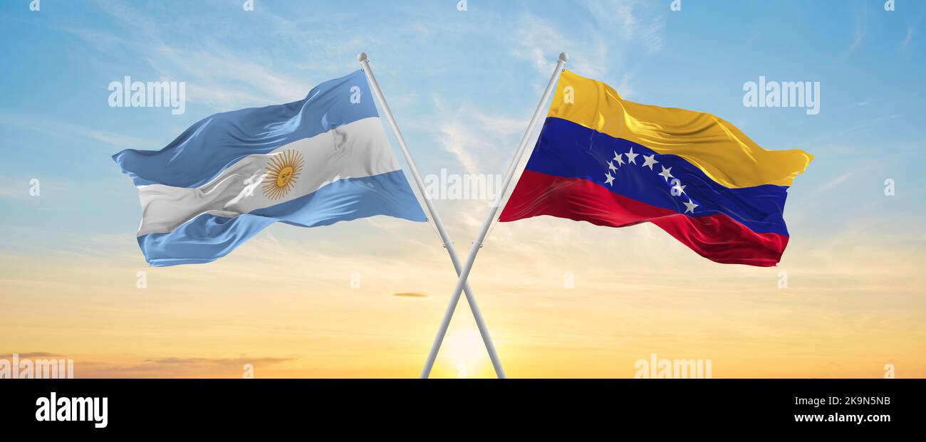 crossed national flags of Argentine and Venezuela flag waving in wind ...