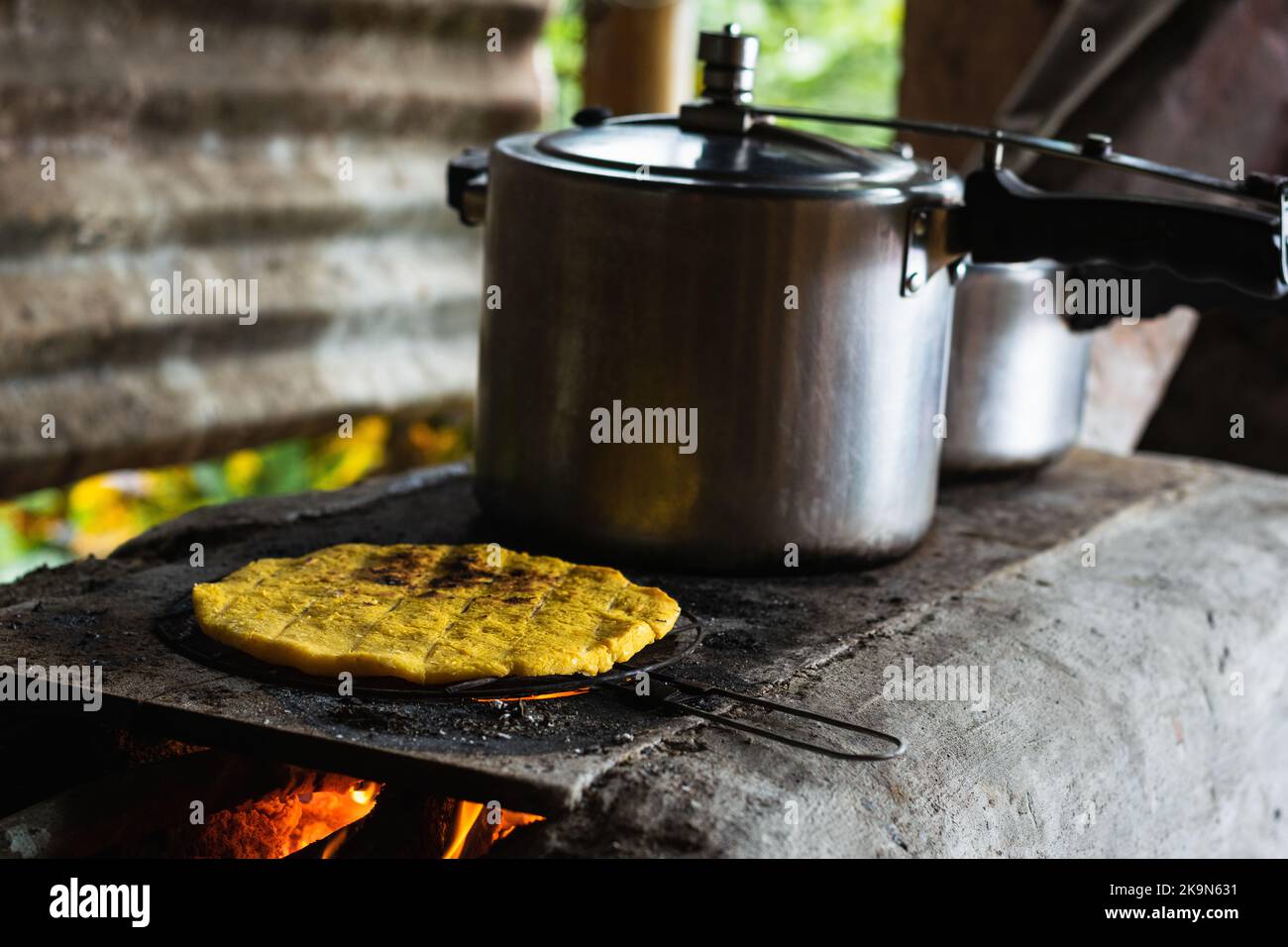 traditional colombian arepa roasting on a typical colombian farm stove