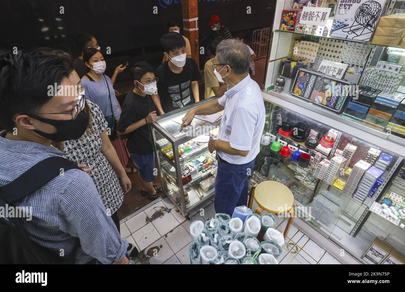 Cheung Shun-king, Mahjong tile artisan and owner of Biu Kee Mah-Jong, serves customers at Biu Kee Mah-Jong in Jordan. The old mahjong tile shop is forced to close at the end of October as it is evicted by the Buildings Department.  06OCT22 SCMP/ Edmond So Stock Photo