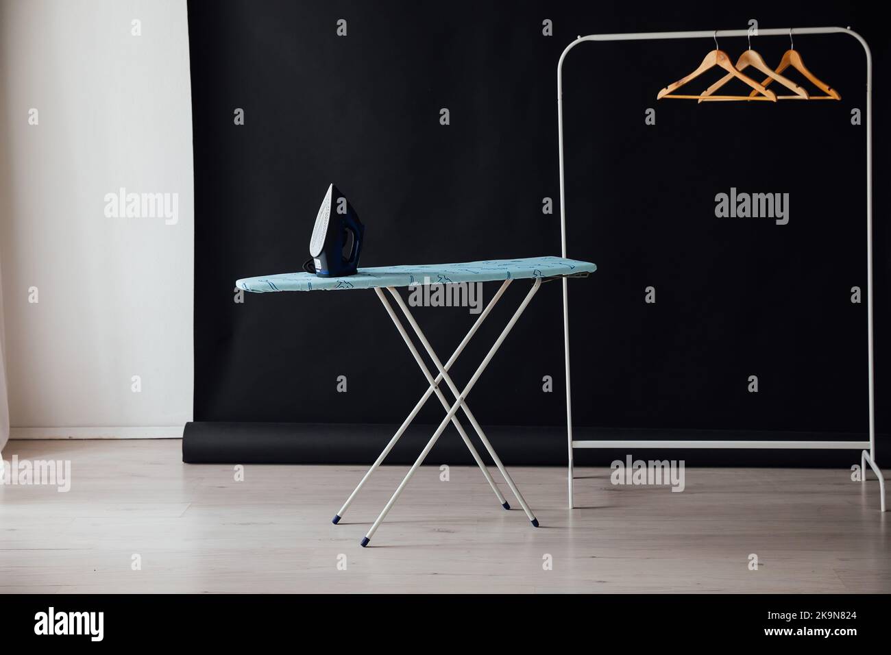 iron and ironing board for ironing things wardrobe Stock Photo