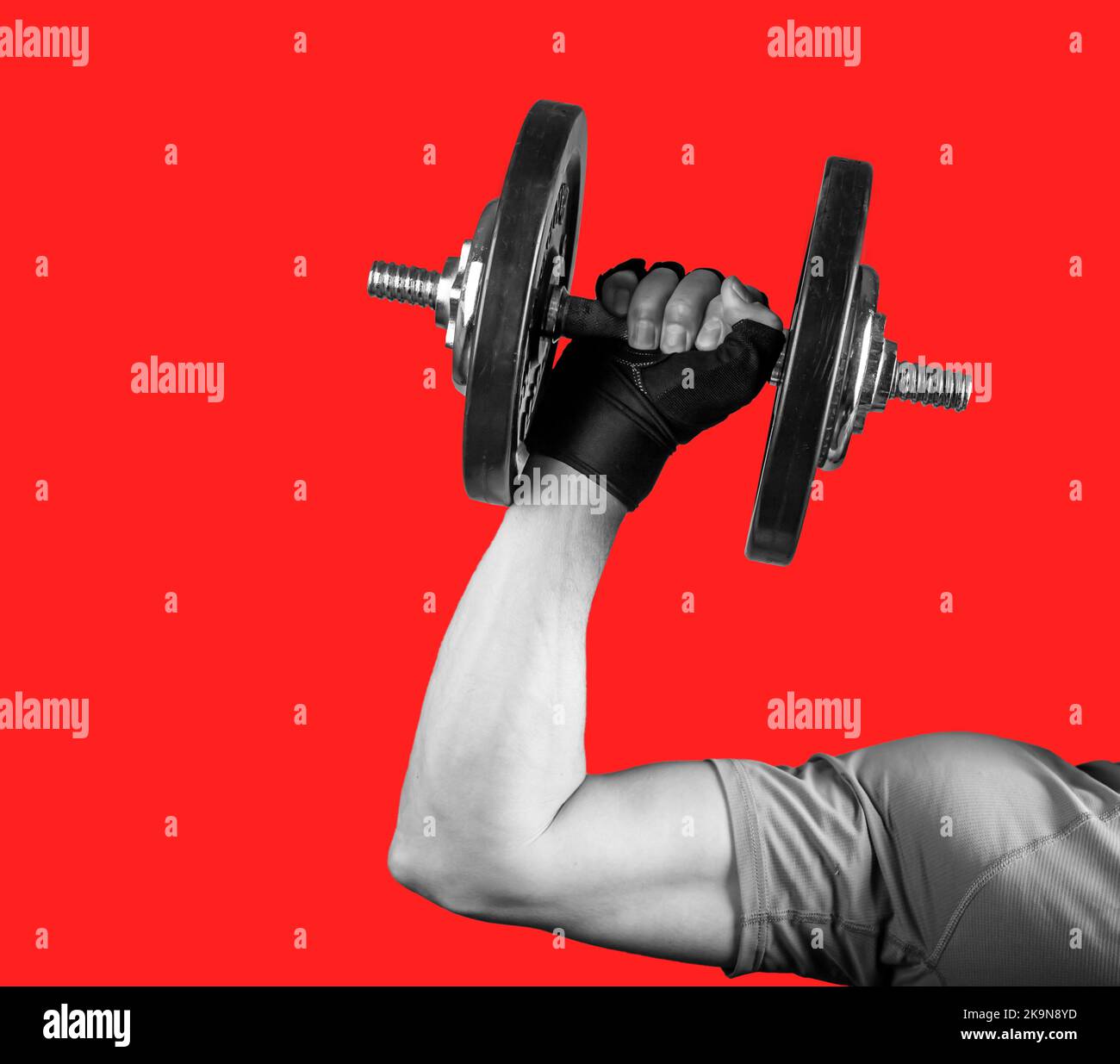 Strong arm hand lifting dumbbell close up for biceps pumping, sport concept. High quality photo Stock Photo