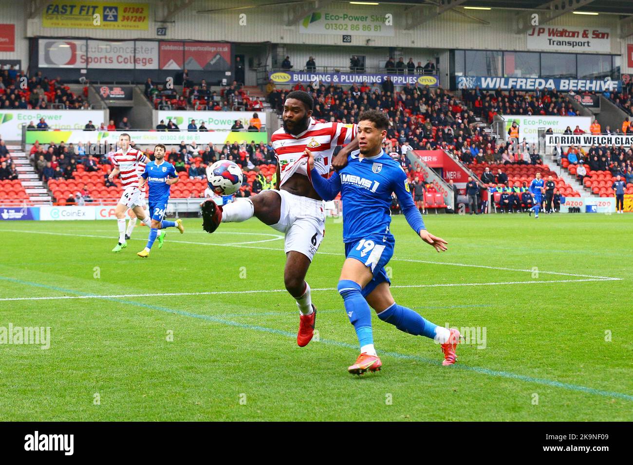 Eco - Power Stadium, Doncaster, England - 29th October 2022 Ro-Shaun Williams (6) of Doncaster Rovers clears the ball under pressure from Scott Kashket (24) of Gillingham - during the game Doncaster Rovers v Gillingham, Sky Bet League Two,  2022/23, Eco - Power Stadium, Doncaster, England - 29th October 2022 Credit: Arthur Haigh/WhiteRosePhotos/Alamy Live News Stock Photo