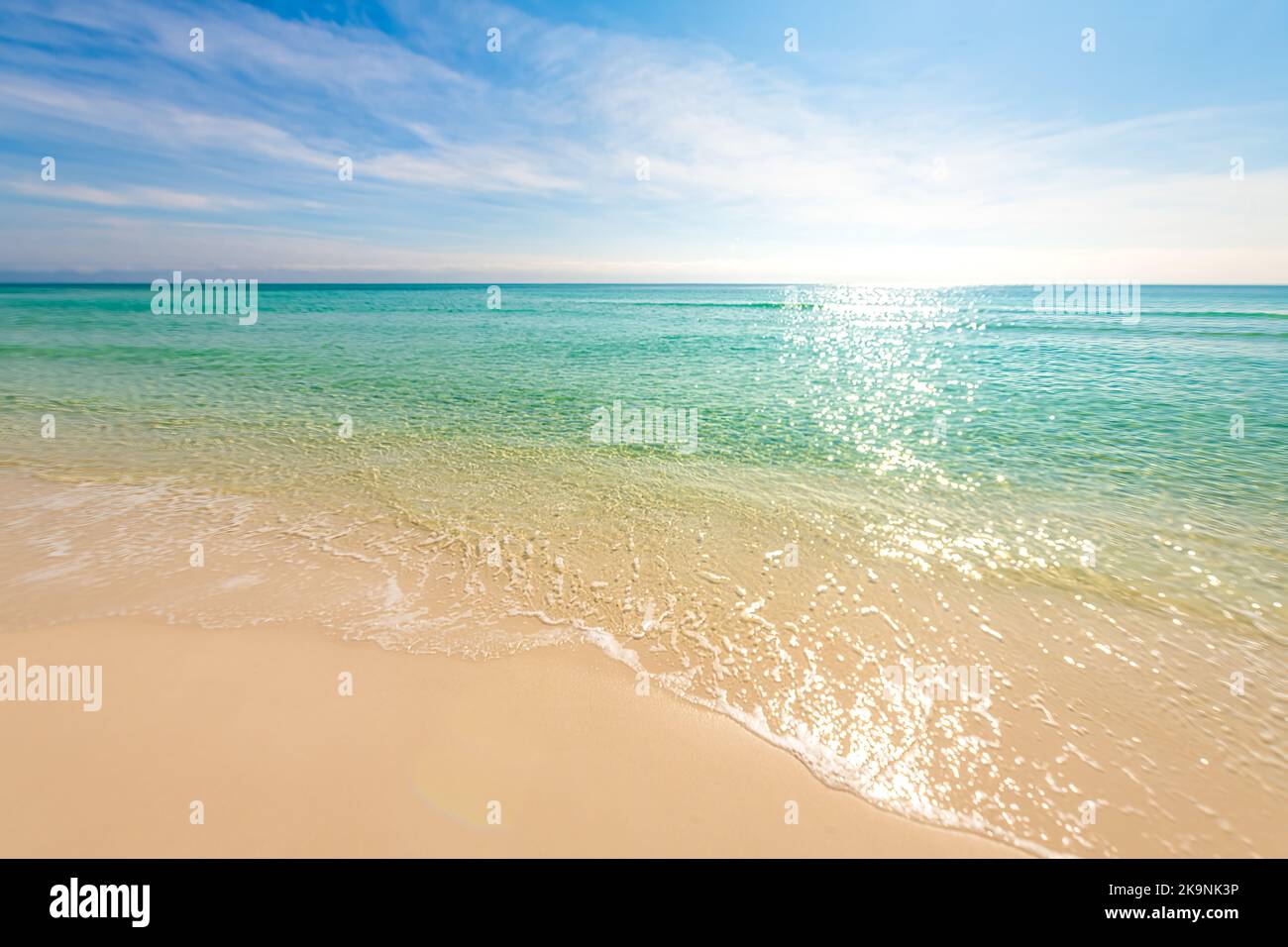 Shiny glitter shimmer waves with sun reflections on Gulf of Mexico ocean water with small ripples on sunny day at city of Miramar, Florida panhandle Stock Photo