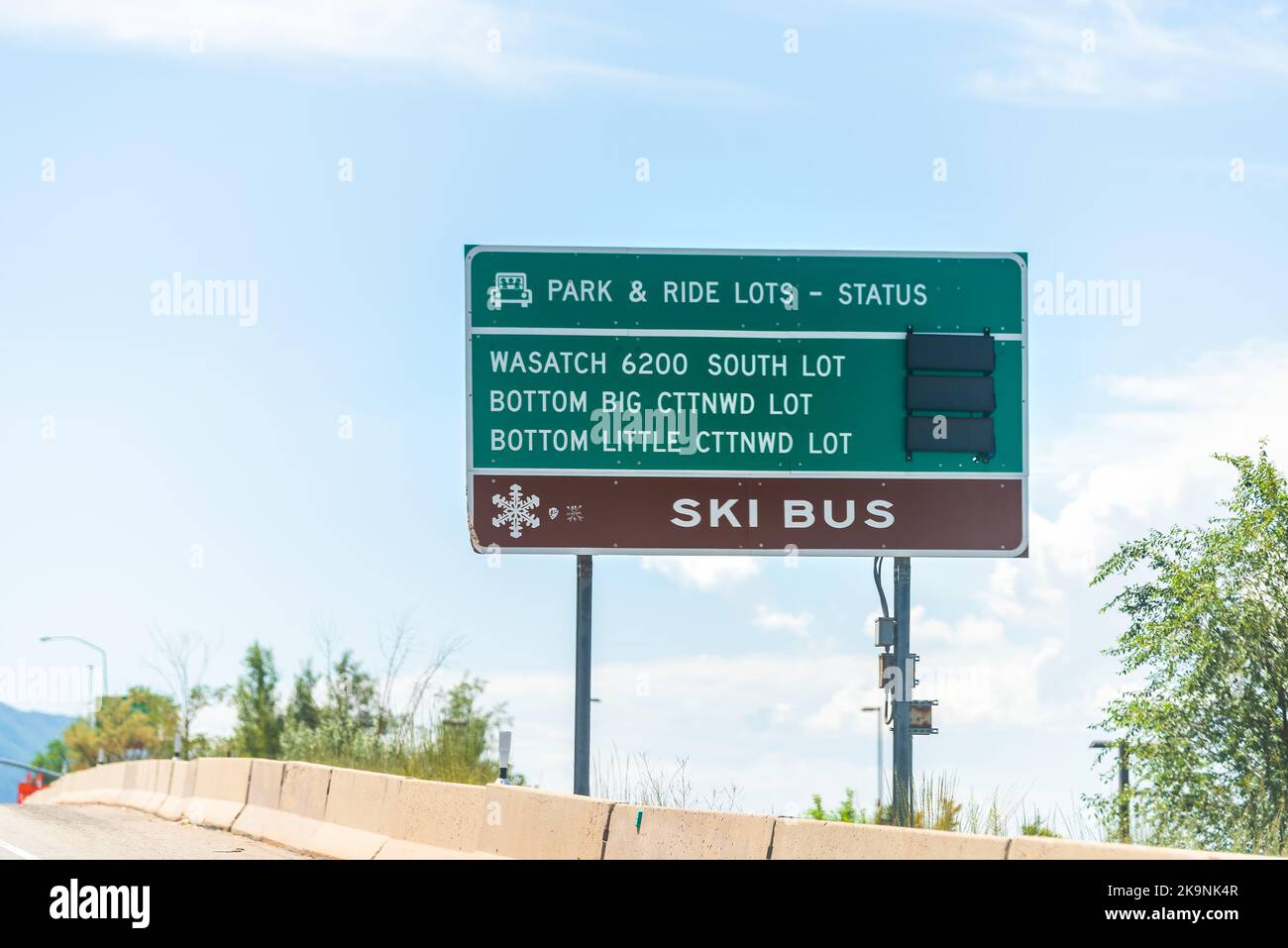 Park City, Utah highway at ski resort town by road sign with parking