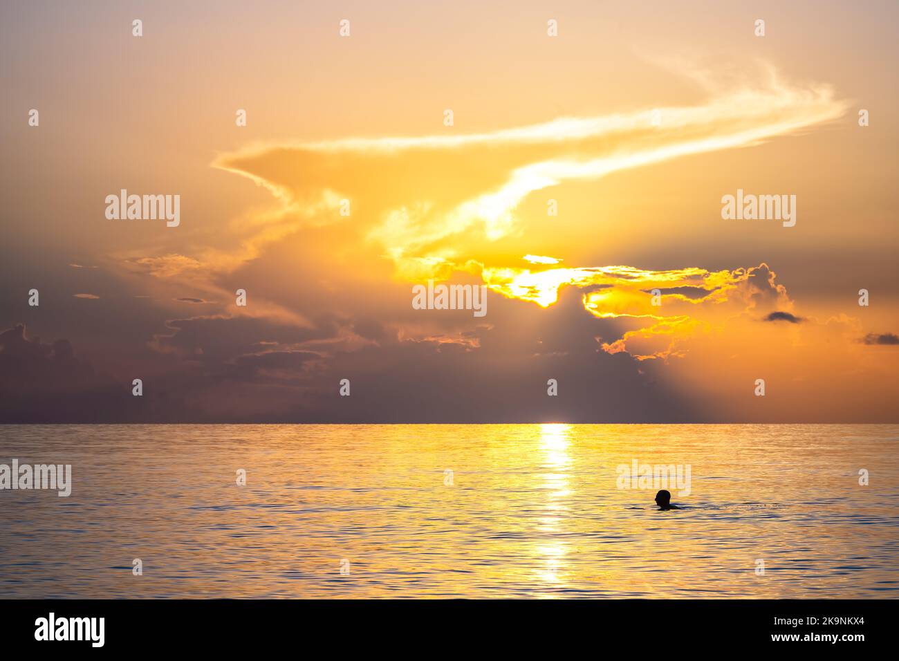 Hollywood Beach in Miami, Florida morning sunrise sun behind sky clouds