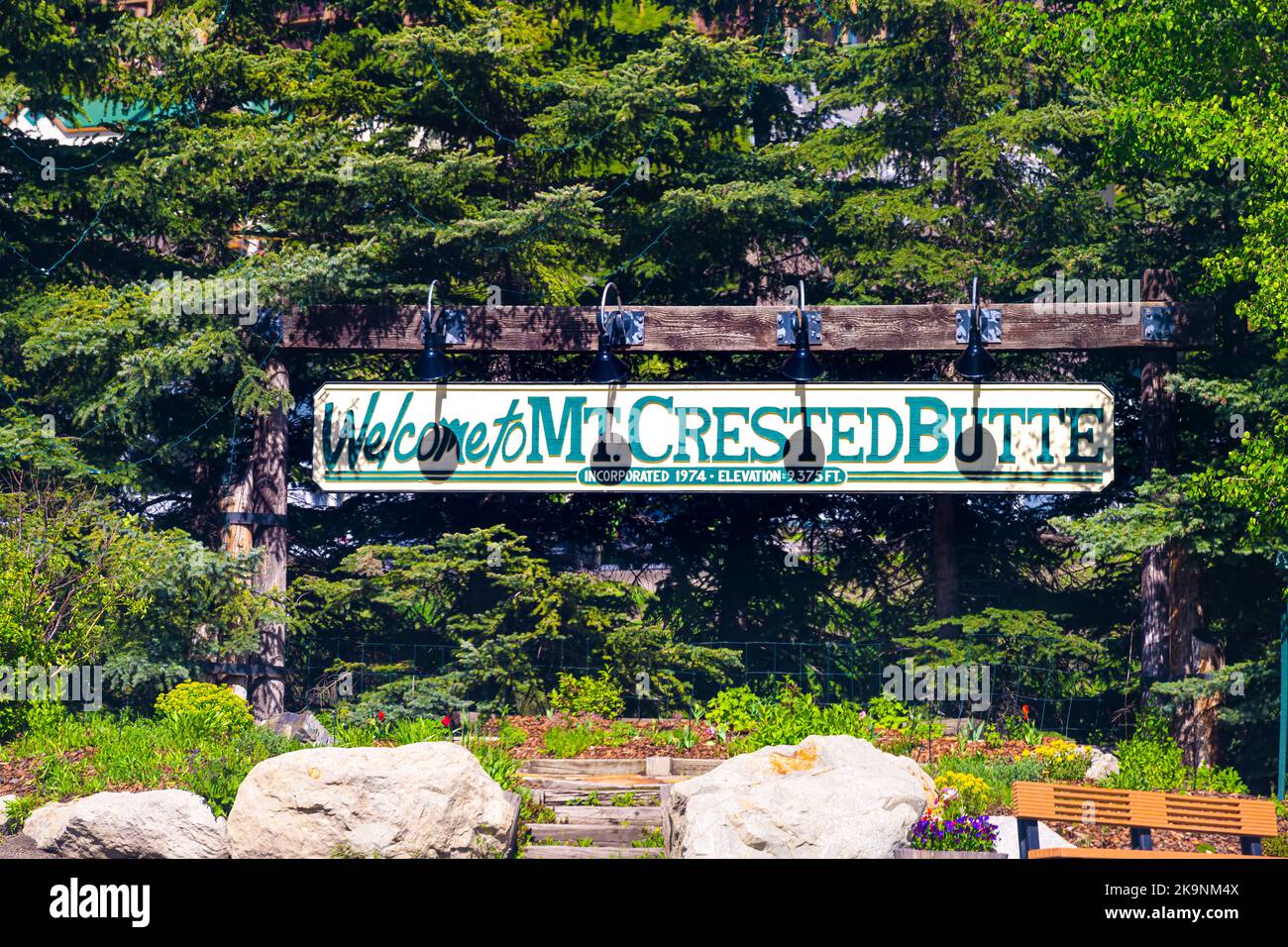 Woode vintage welcome to Mt Mount Crested Butte, Colorado village sign at ski resort town, small city in summer with entrance Stock Photo