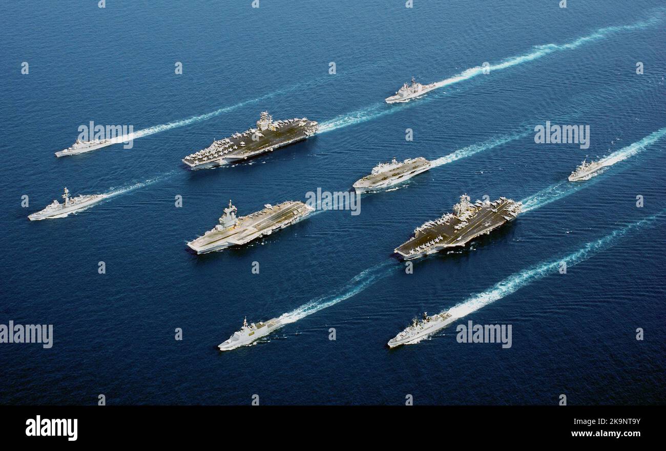 From top row left to right: the Italian Navy ship Frigate MM MAESTRALE (F 570), French Navy Destroyer DE GRASSE (D 612), Nimitz Class Aircraft Carrier USS JOHN C. STENNIS (CVN 74), US Navy (USN) Cruisers USS PORT ROYAL (CG 73), French Navy Aircraft Carrier CHARLES DE GAULLE (R 91), Royal Navy Helicopter Carrier, HMS OCEAN (L 12), French Frigate SURCOUF (F 711), Aircraft Carrier USS JOHN F. KENNEDY (CV 67), Netherlands Navy Frigate Her Majesty’s Netherlands Ship (Harer Majesteits) (HNLMS) VAN AMSTEL (F 831), Italian Navy De La Penne (ex-Animoso) Class Destroyer, MM LUIGI DURAND DE LA PENNE Stock Photo