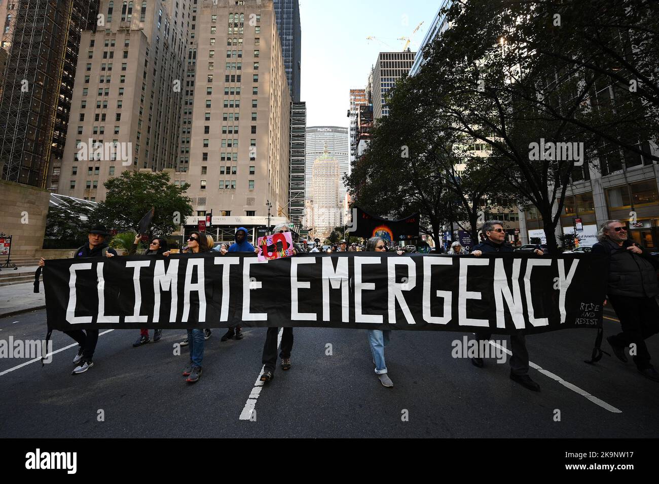 New York, USA. 29th Oct, 2022. Climate activists march down Park Avenue