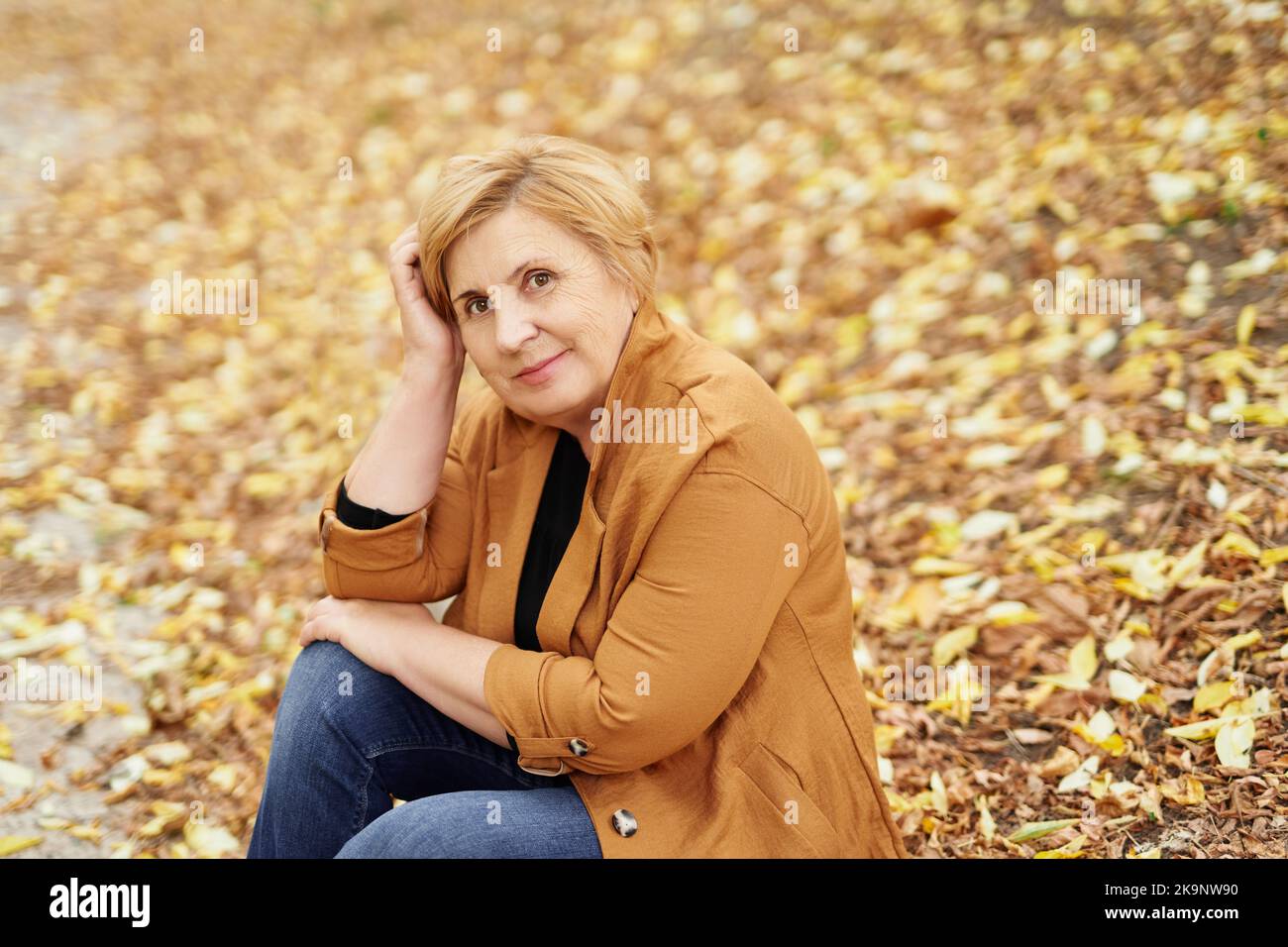 Mature woman alone walking park hi-res stock photography and images - Alamy
