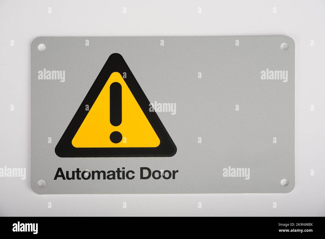 Automatic electric gate opener sign on a white Stock Photo