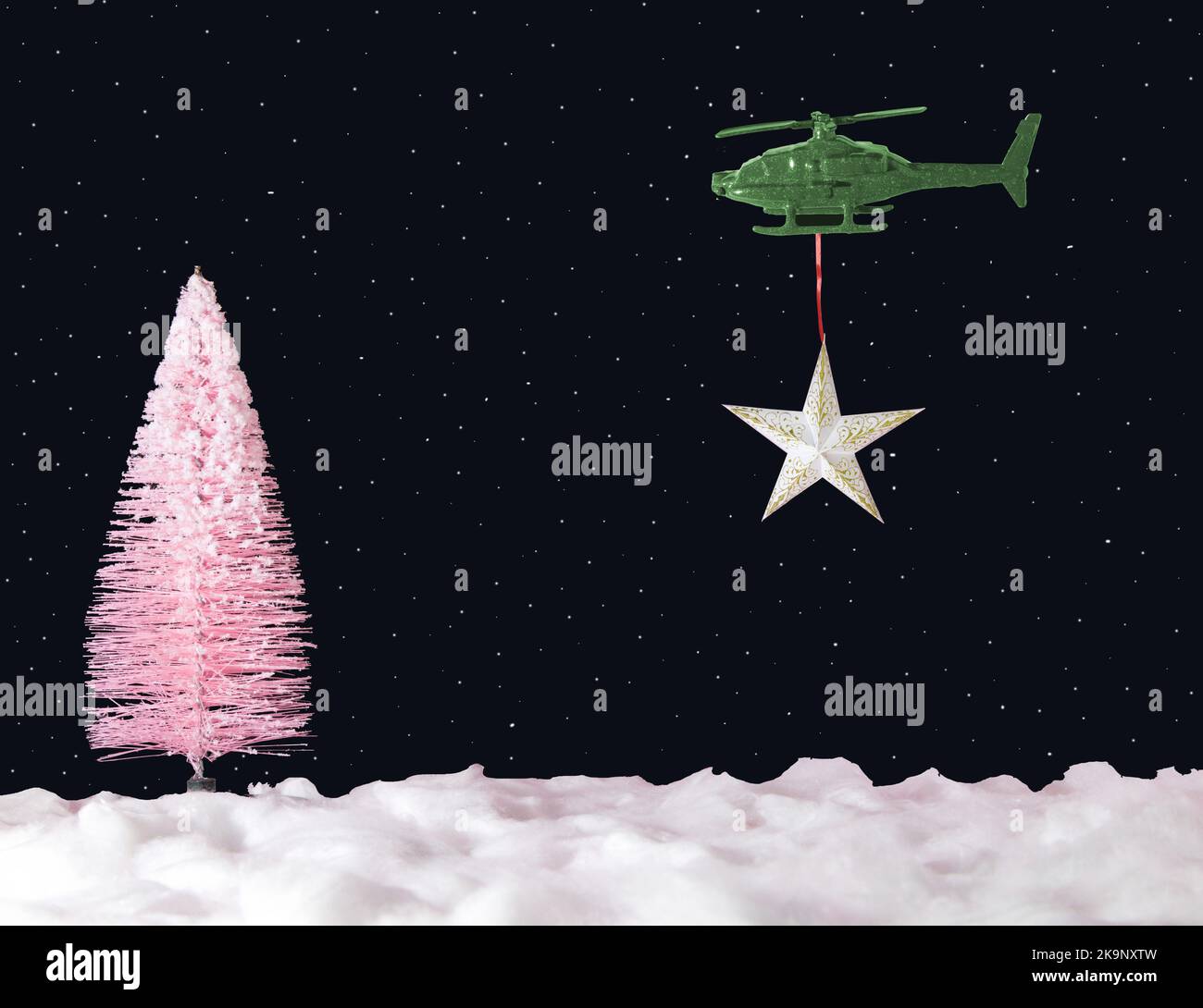 helicopter carries a star to the top of the Christmas tree, pink