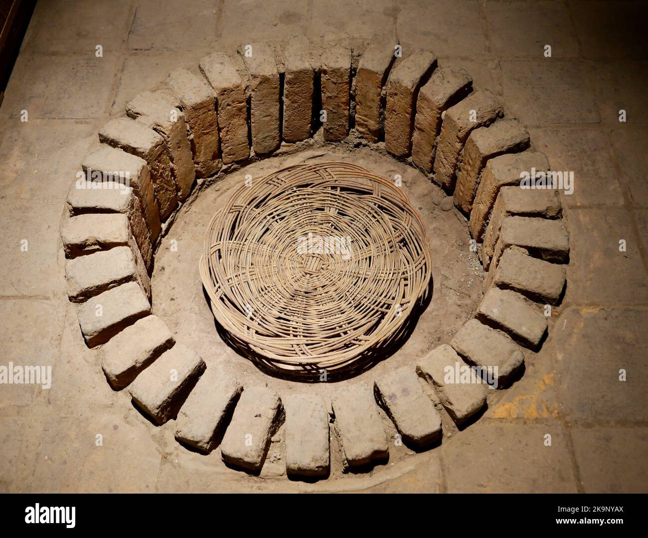 Aerial view of round hole in the floor for Kveri clay jugs in
