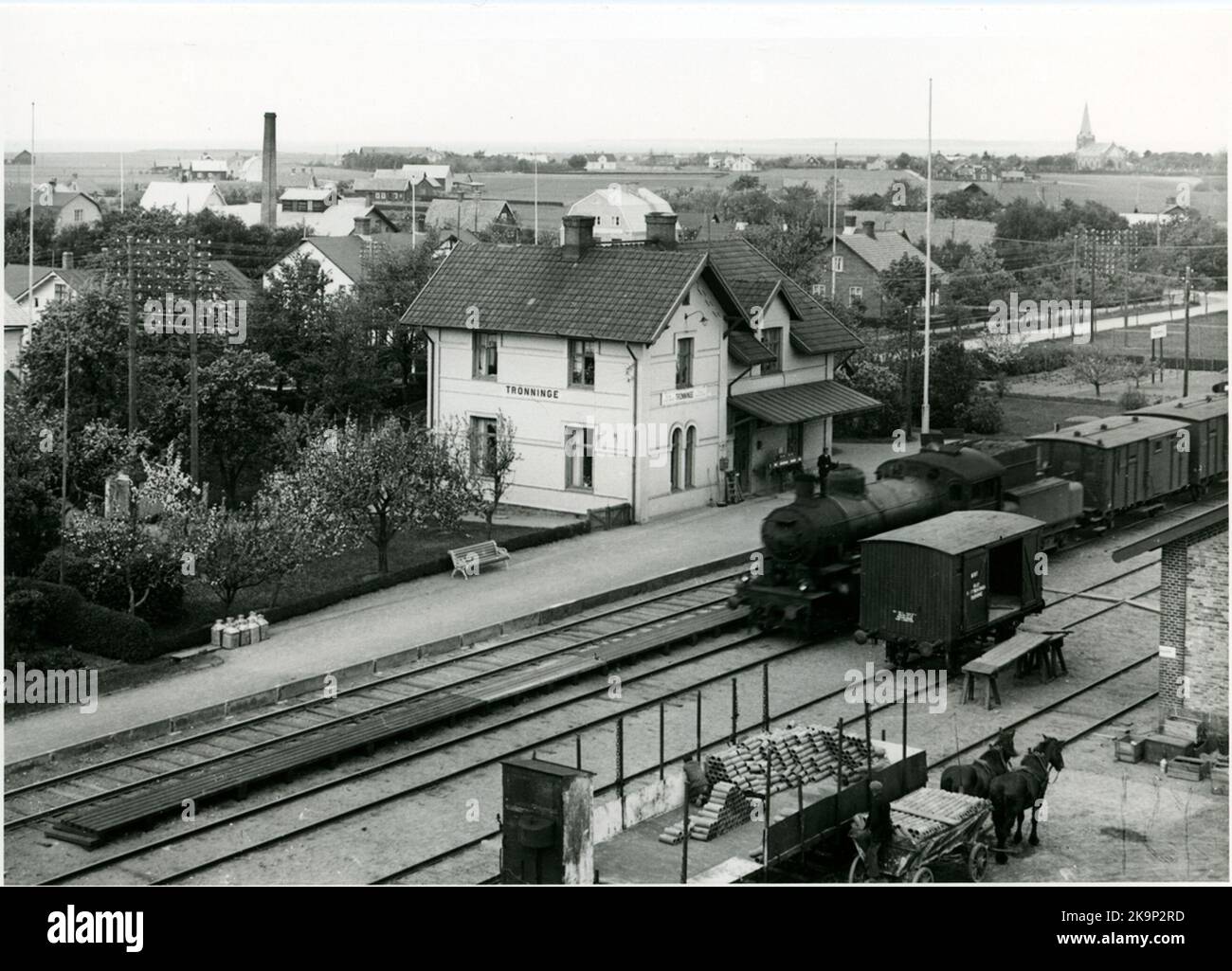 View of Trönninge station community. Originally Skåne-Halland Railway, SHJ.Tåget, Snälltåg no. 43 consists of the State Railways, SJ B-LOK, Double trailers F1.The carriage next to the steam locomotive is a so-called freight move car, former GÄ 317. These wagons were used internally at the station.Tt.tt Stock Photo