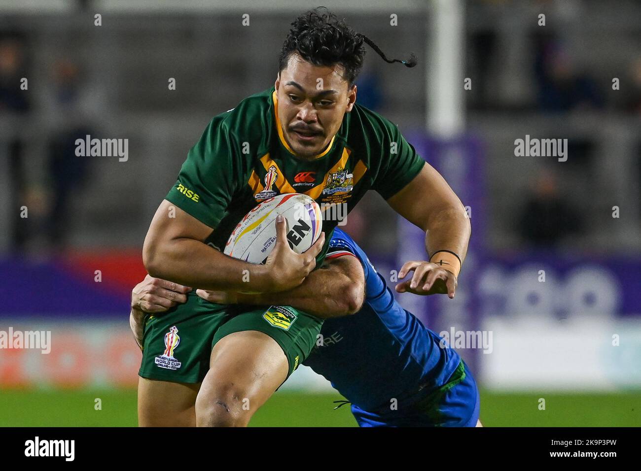 Jeremiah Nanai of Australia is tackled by Jack Campagnolo of Italy
