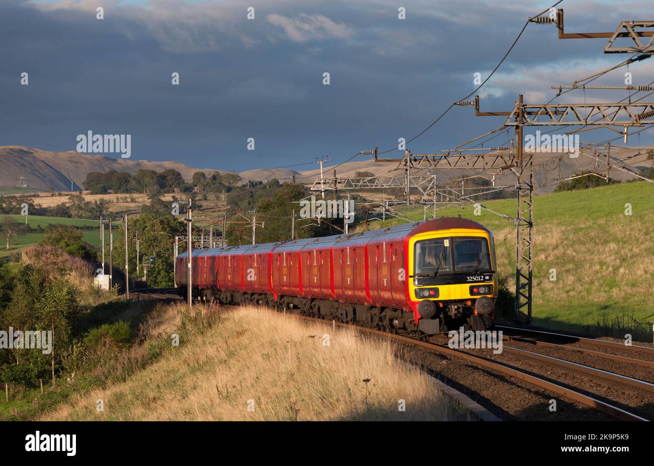 3 Royal mail class 325 electric freight units passing Lambrigg, on the