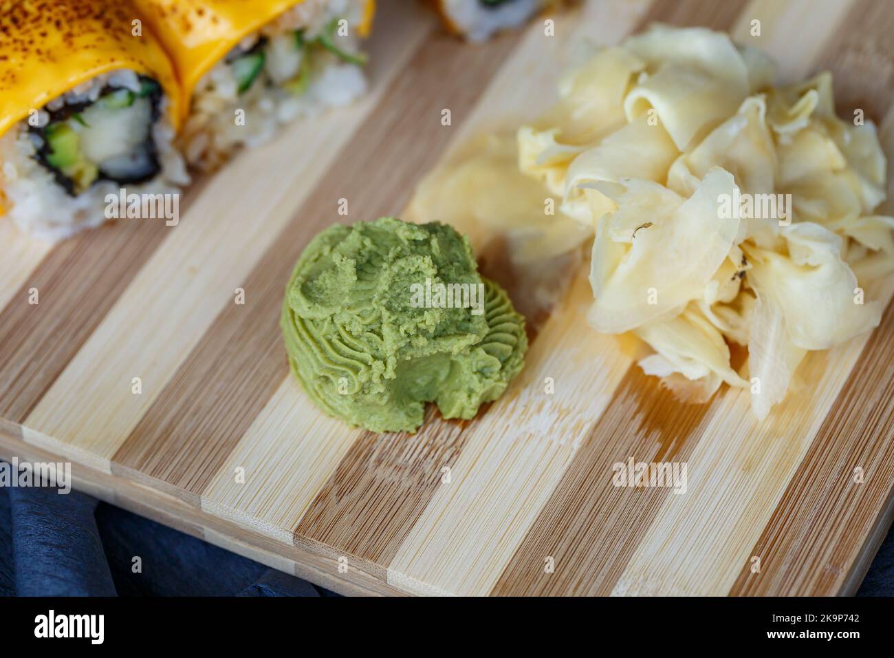 Sushi set with different types of rolls and sashimi made from eel
