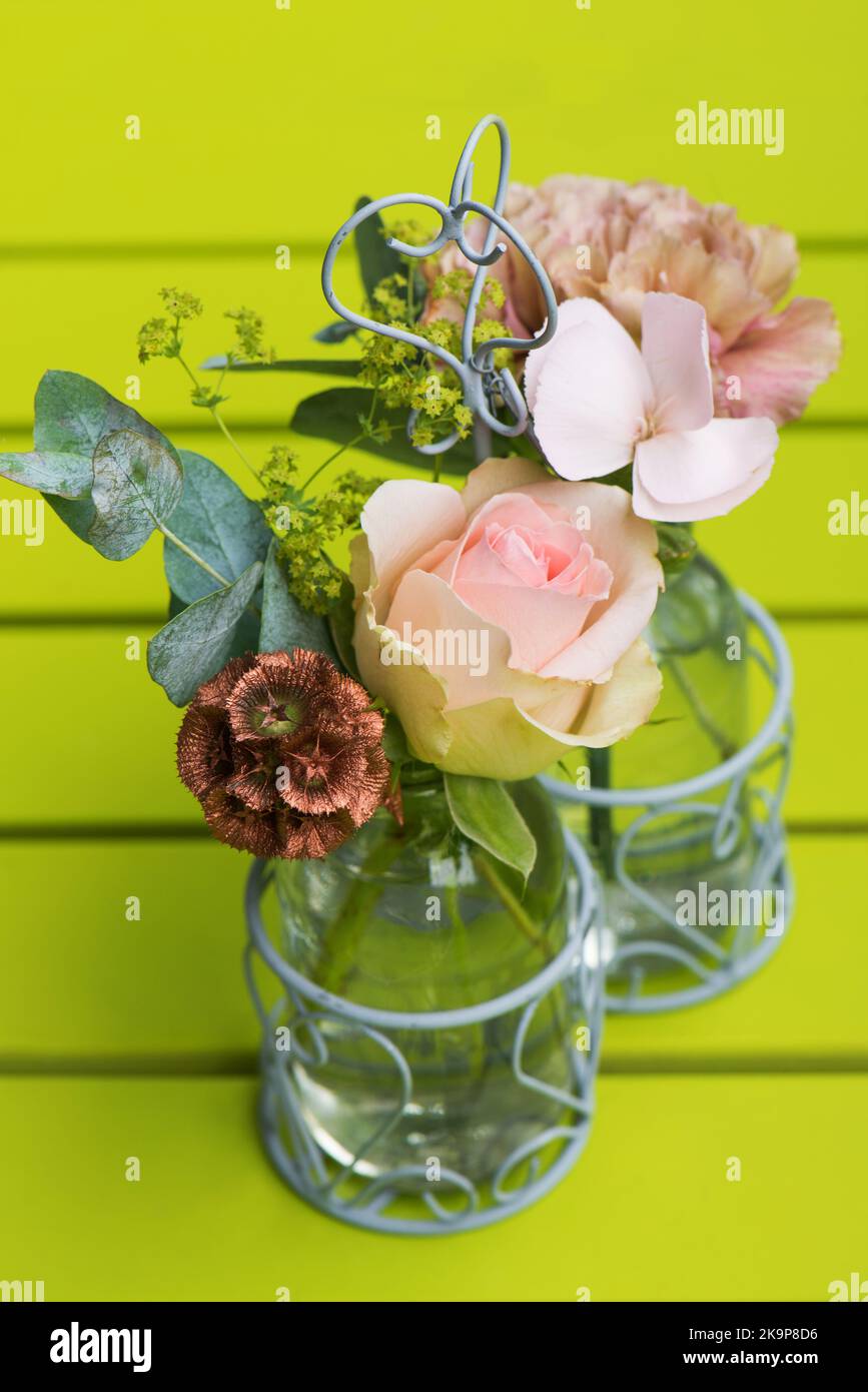 Little flowers in little bottles Stock Photo
