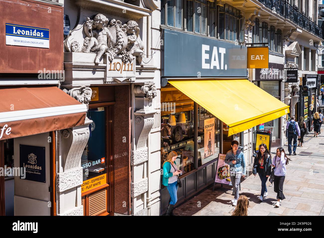 London, United Kingdom - June 22, 2018: Above view on Fleet street with people walking by Eat. sandwich store shop restaurant or cafe in summer Stock Photo