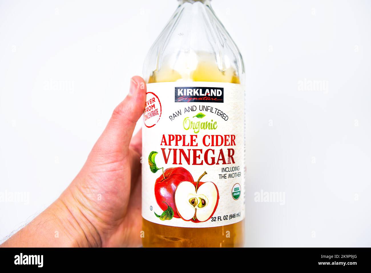 Naples, USA October 21, 2021 Macro closeup of hand holding raw