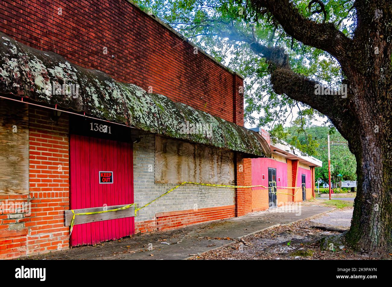An abandoned strip mall is pictured, Oct. 24, 2022, in Bayou La Batre, Alabama. The abandoned