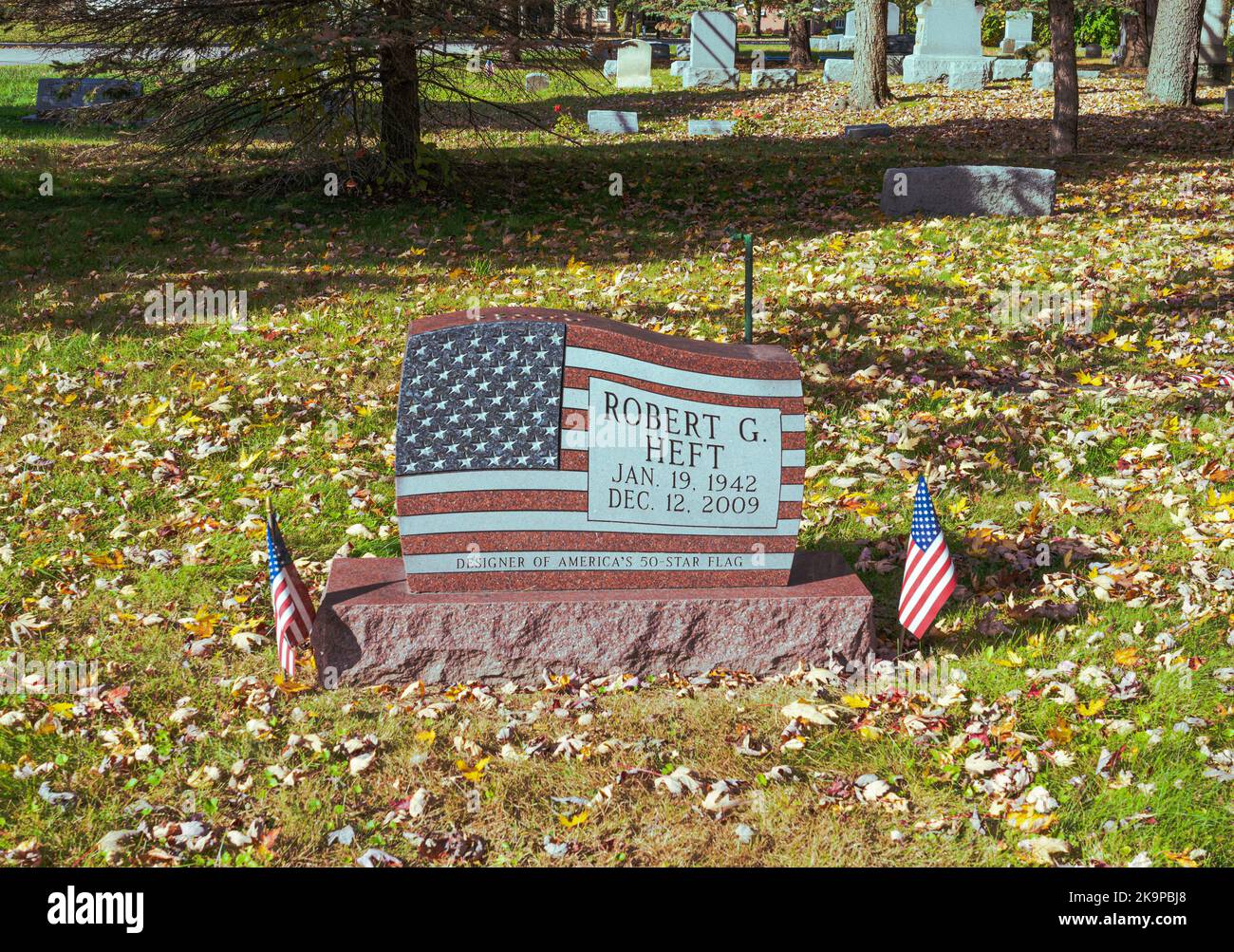 50 Star USA American flag designed by Robert Heft on display on gravestone in Saginaw, Michigan Lutheran cemetery. Granite stone is the marker. Stock Photo