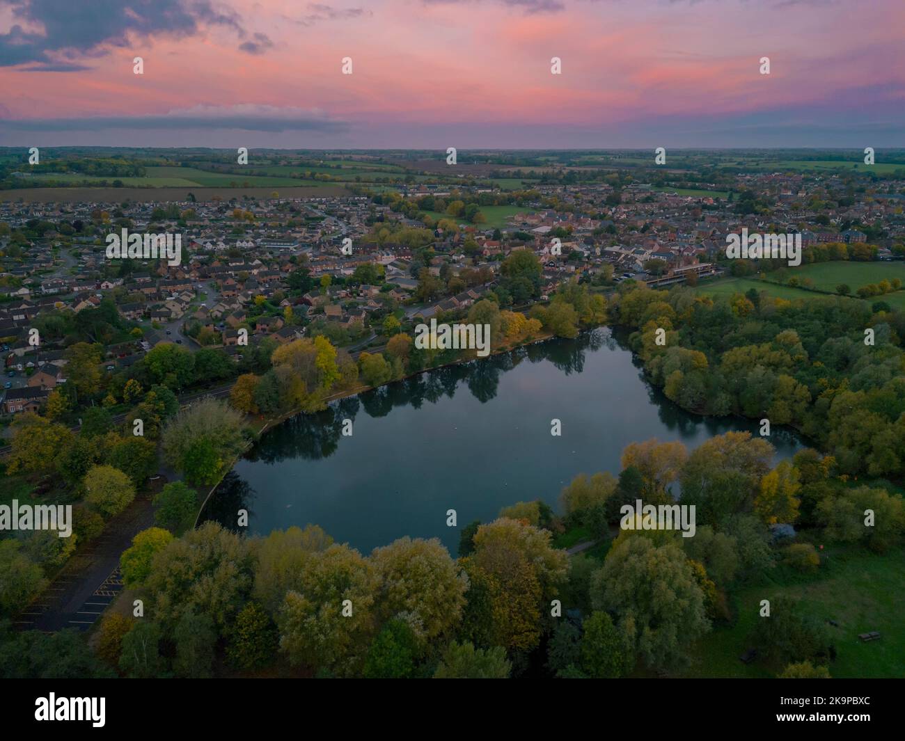 An aerial view of the lake at sunrise in Needham Market, Suffolk UK