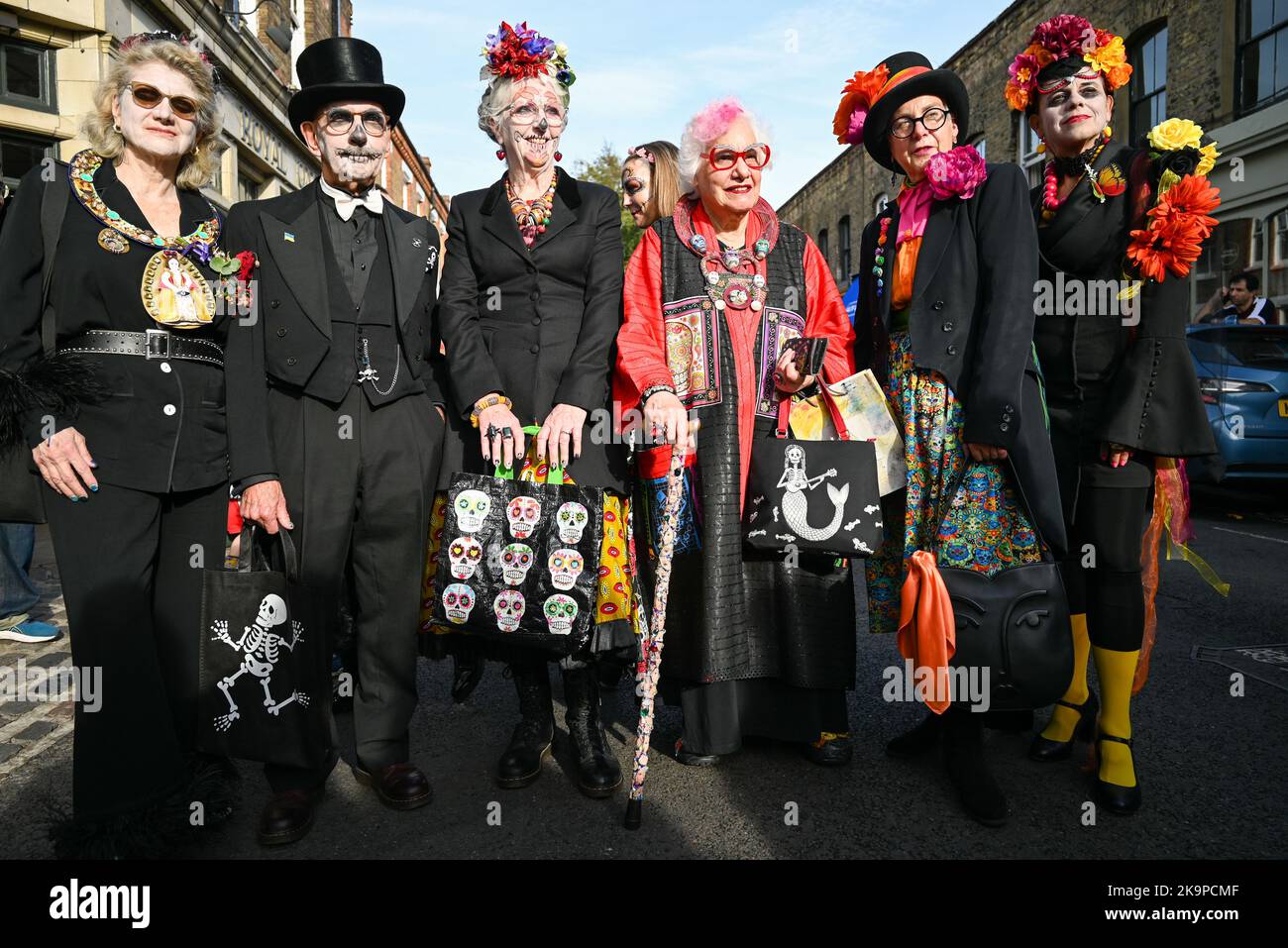 London, UK. 29th Oct, 2022. People in costumes pose for a photo during the Day of the Dead Event in Columbia Road, London. Columbia Road Shops celebrate London Day of the Dead Festival on 29th October 2022 from 12pm onwards. Credit: SOPA Images Limited/Alamy Live News Stock Photo