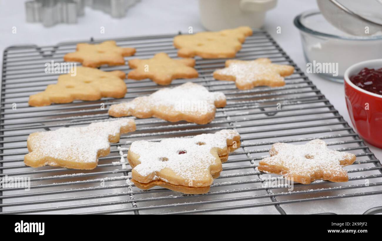 Christmas shortbread cookies with raspberry jam recipe, close up baking ...
