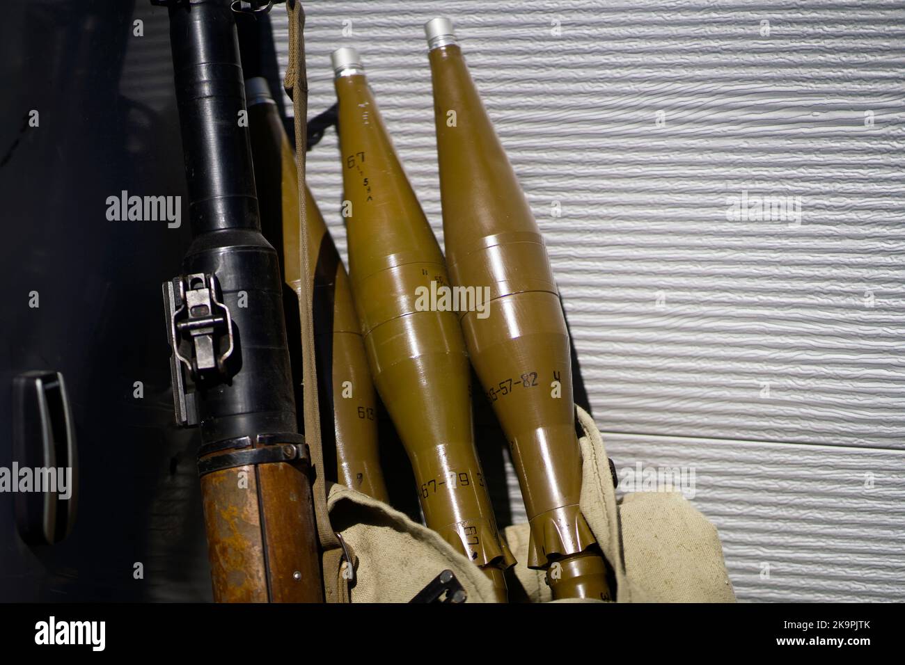 Gun and artillery shells, militant equipment closeup. Stock Photo