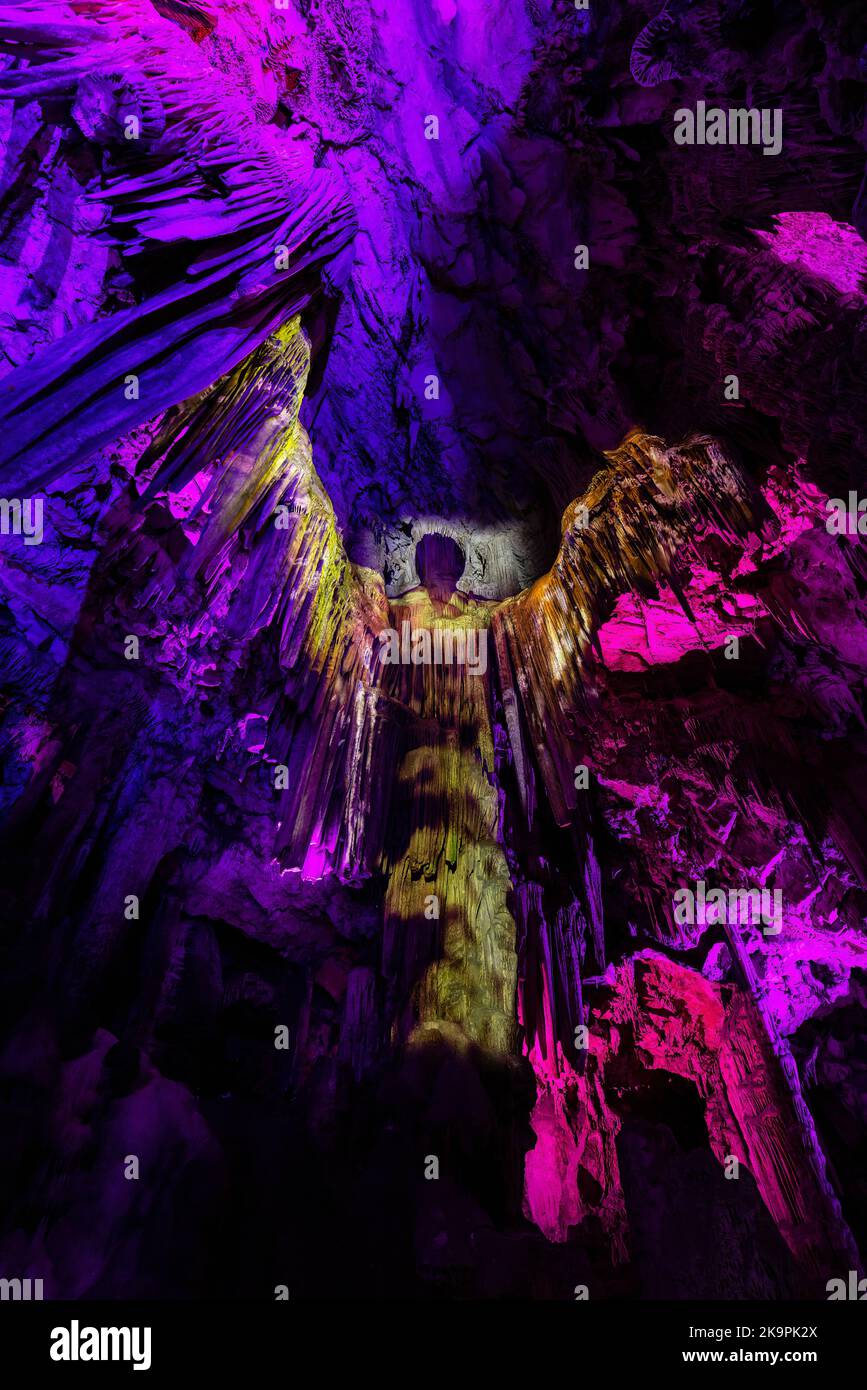 Saint Michael's Cave with colorful lights with Angel. Natural Rock Formation. Stock Photo