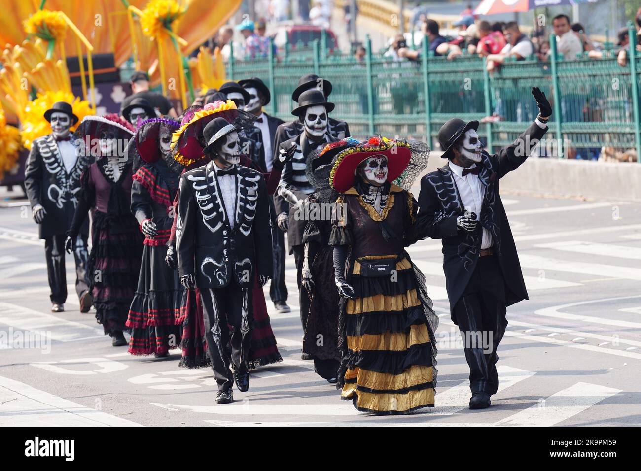 Mexico City, Mexico. 29th Oct, 2022. Performers wearing dressed a skeleton grooms and brides wave as they march in the Grand Parade of the Dead to celebrate Dia de los Muertos holiday on Paseo de la Reforma, October 29, 2022 in Mexico City, Mexico. Credit: Richard Ellis/Richard Ellis/Alamy Live News Stock Photo