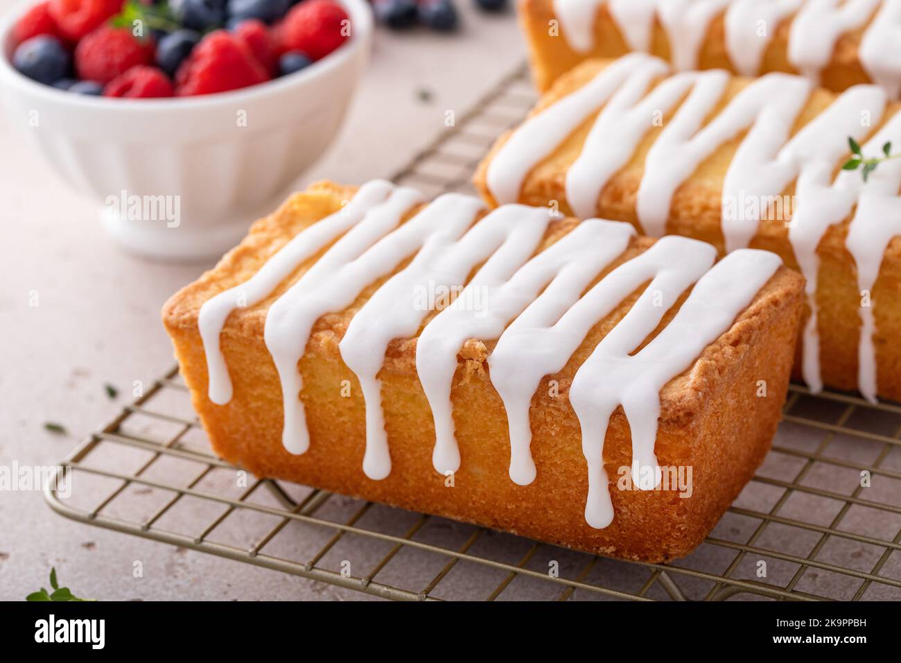 Classic pound cake with powdered sugar glaze dripping over Stock Photo