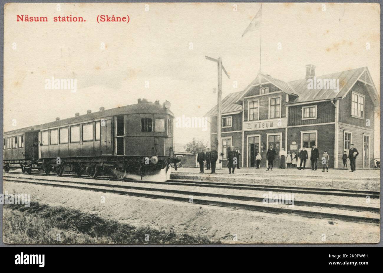 The railway station in Näsum in 1908 with a steam car in the foreground. Stock Photo