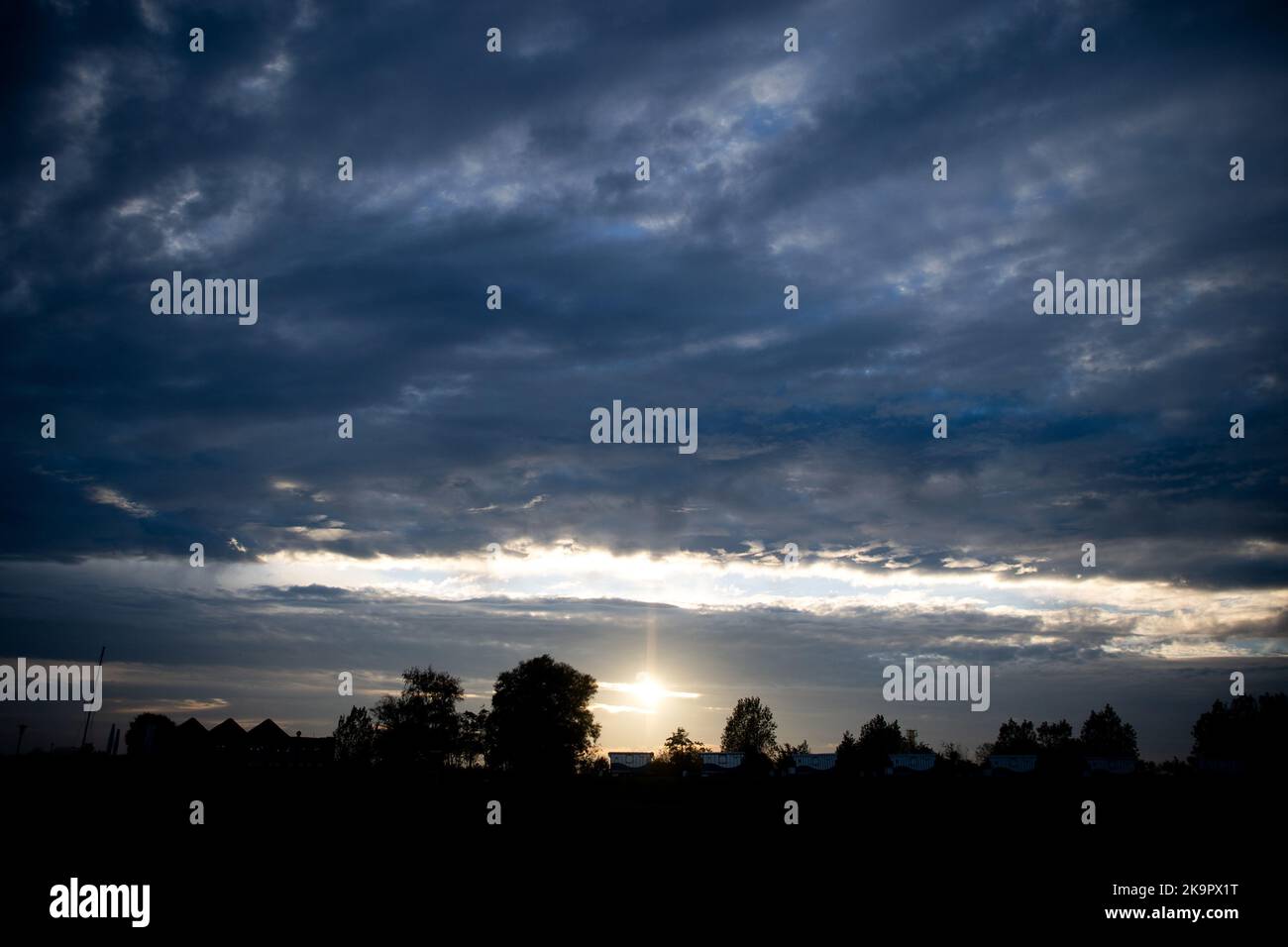 Sun shines through passing clouds hi-res stock photography and images ...