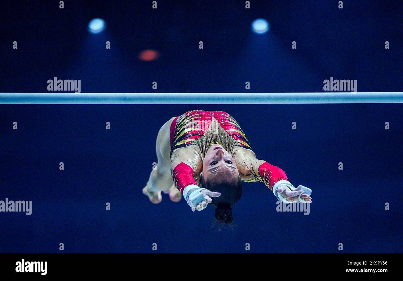 Belgium's Nina Derwael competes on the asymmetrical bars during day one
