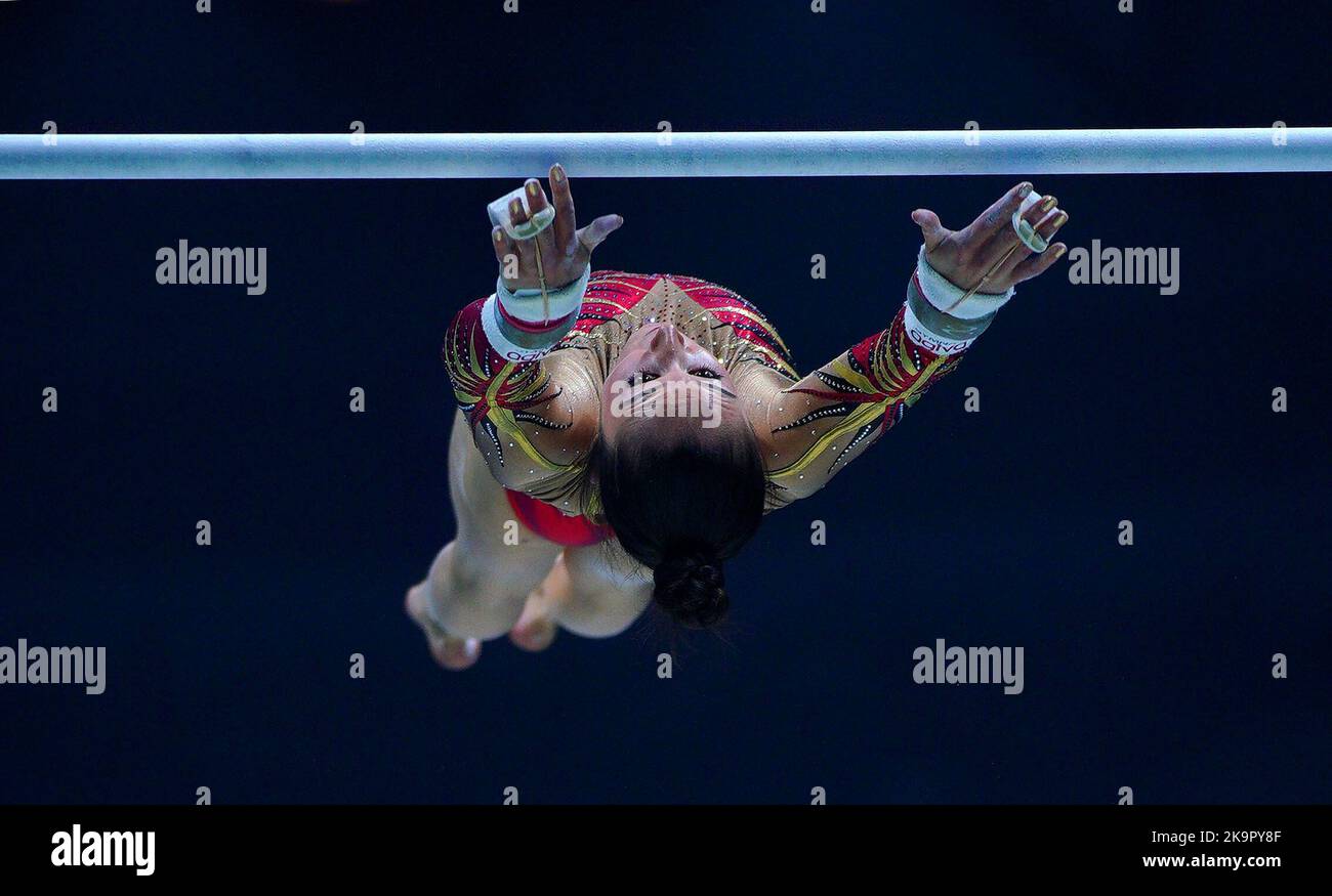 Belgium's Nina Derwael competes on the asymmetrical bars during day one