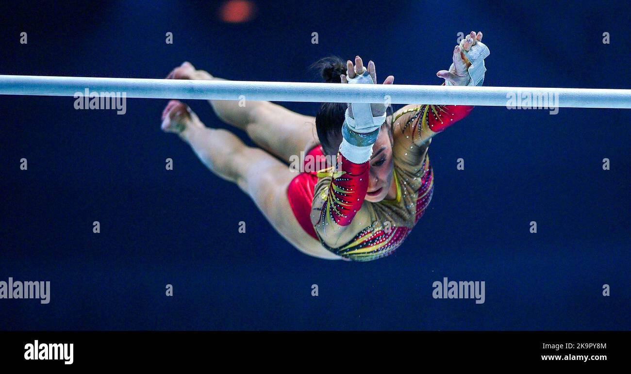 Belgium's Nina Derwael competes on the asymmetrical bars during day one