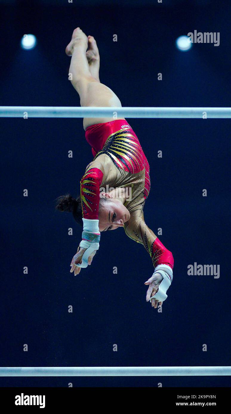 Belgium's Nina Derwael competes on the asymmetrical bars during day one
