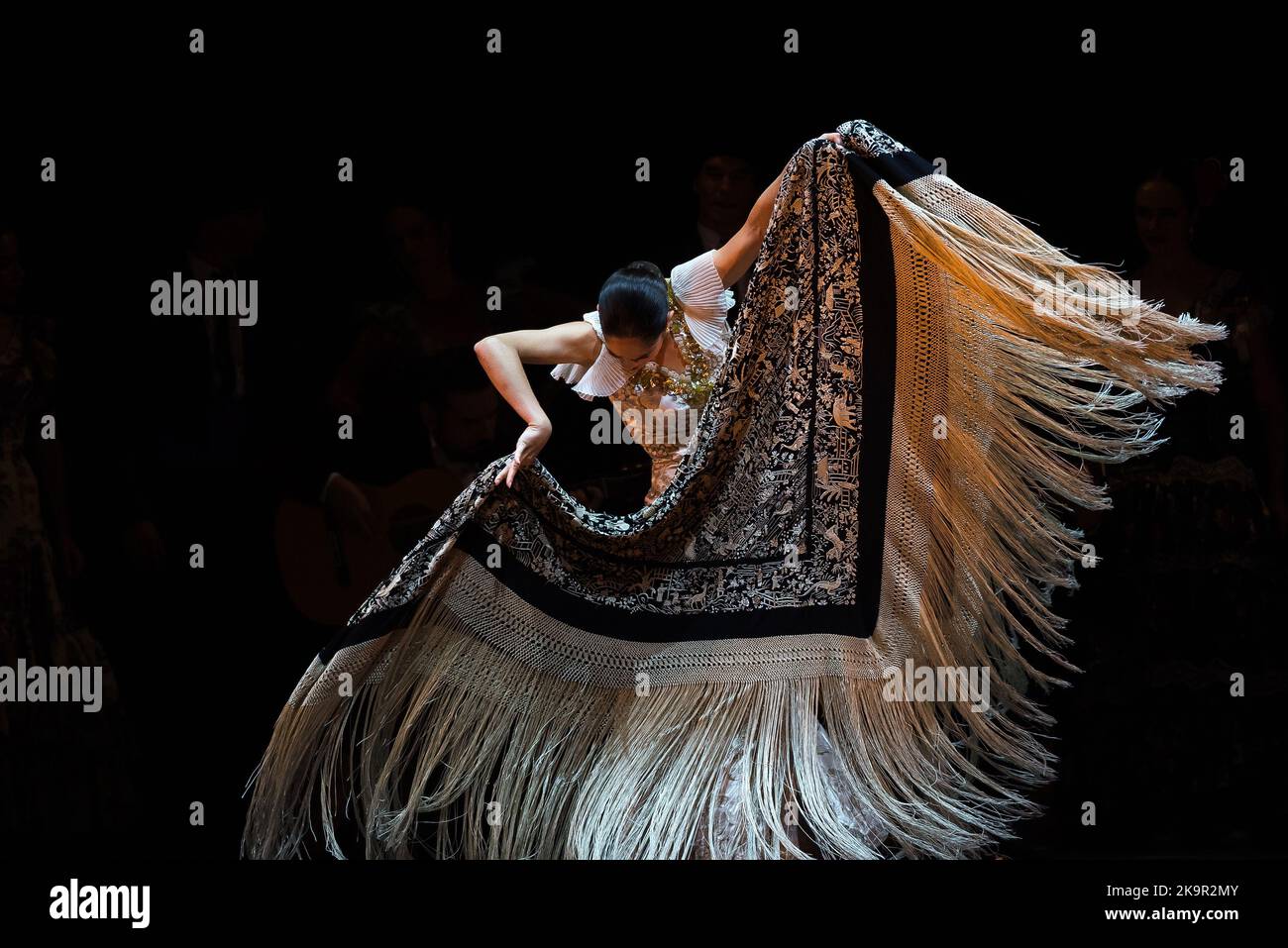 A dancer wearing a shawl performs on the stage during the first night of 'La Bella Otero' ballet