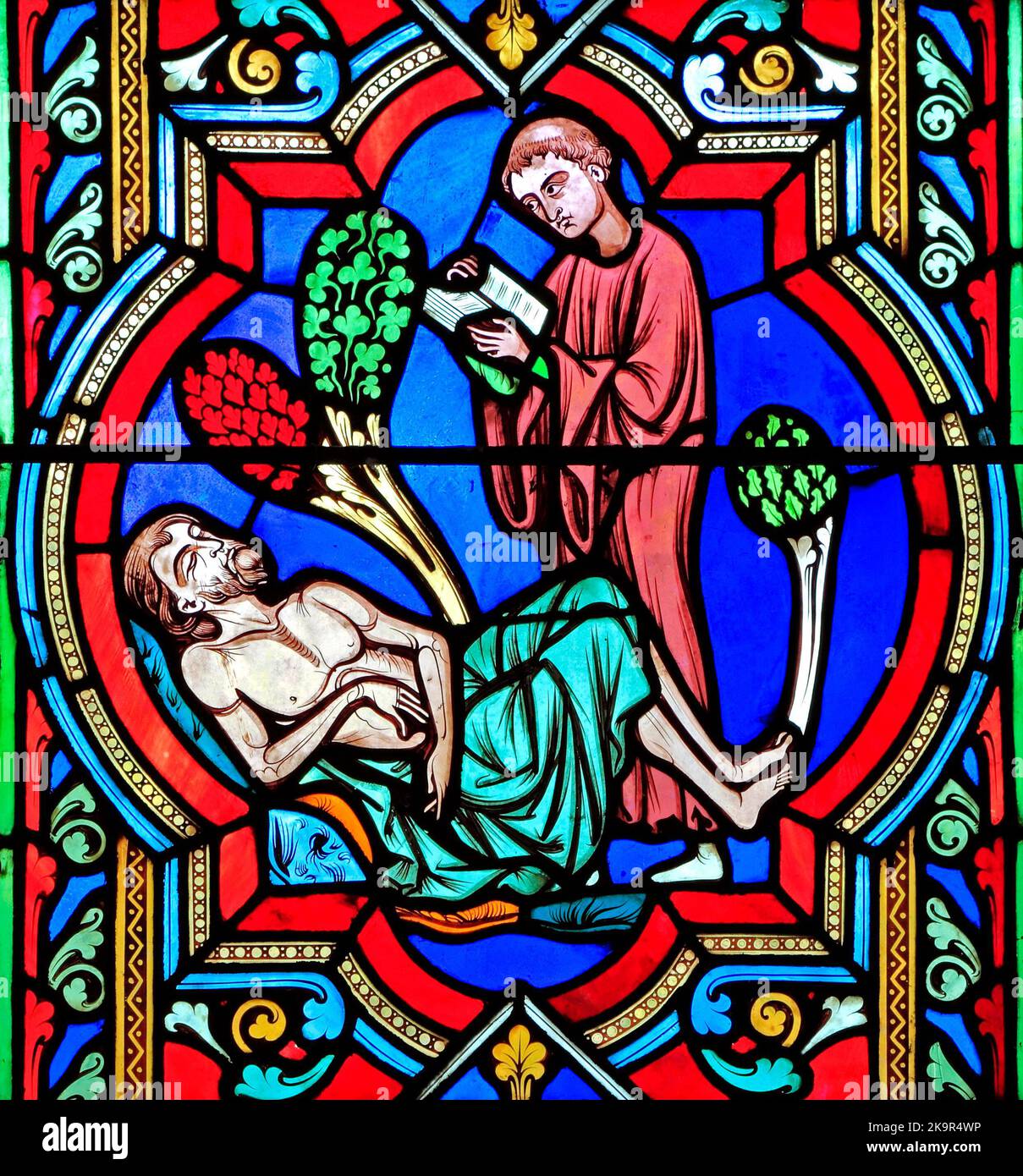 The Good Samaritan Parable, a Levite 'passes by on the other side', ignoring dying traveller, stained glass window by Oudinot of Paris, 1859, Feltwell Stock Photo