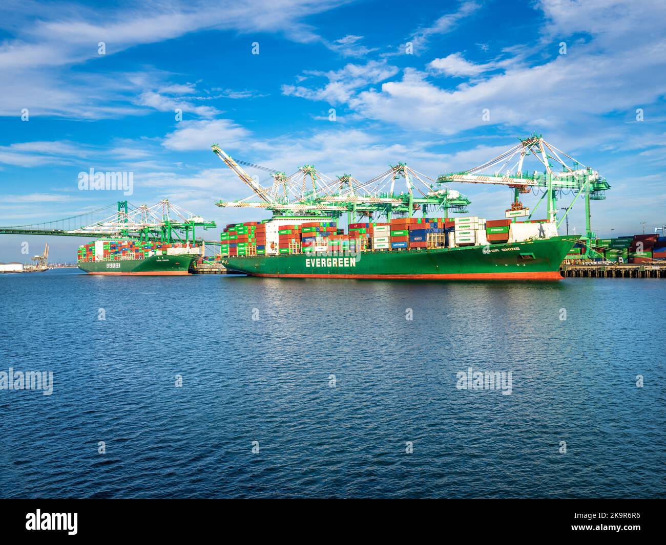 Los Angeles, CA, USA - November 17, 2017: Two Evergreen container ships -- Ever Lunar and Ever Shine -- load cargo at the Everport terminal, one of 25 Stock Photo