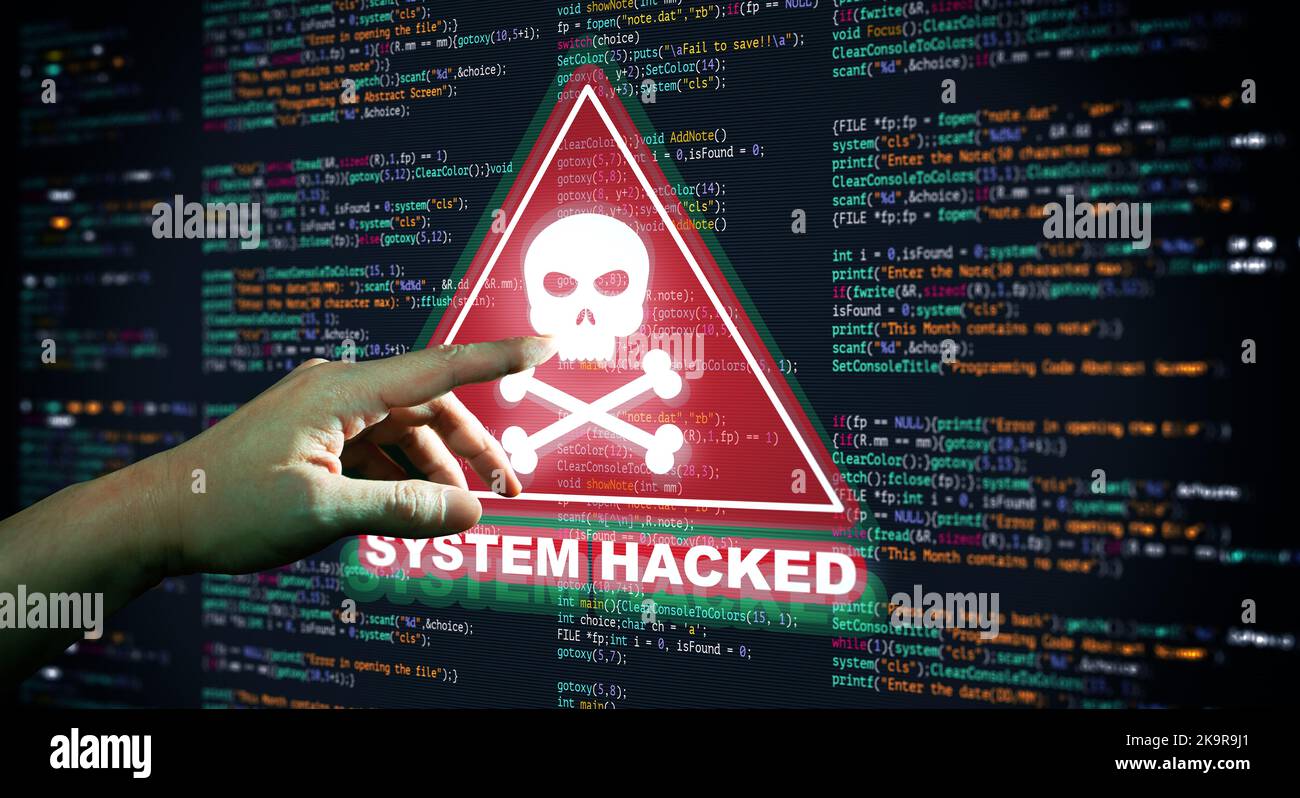Hand Pointing Abstract Modern tech of Programming code screen with Warning alert of System hacked. Virus, Malware, Cyber attack, and Internet cyber se Stock Photo