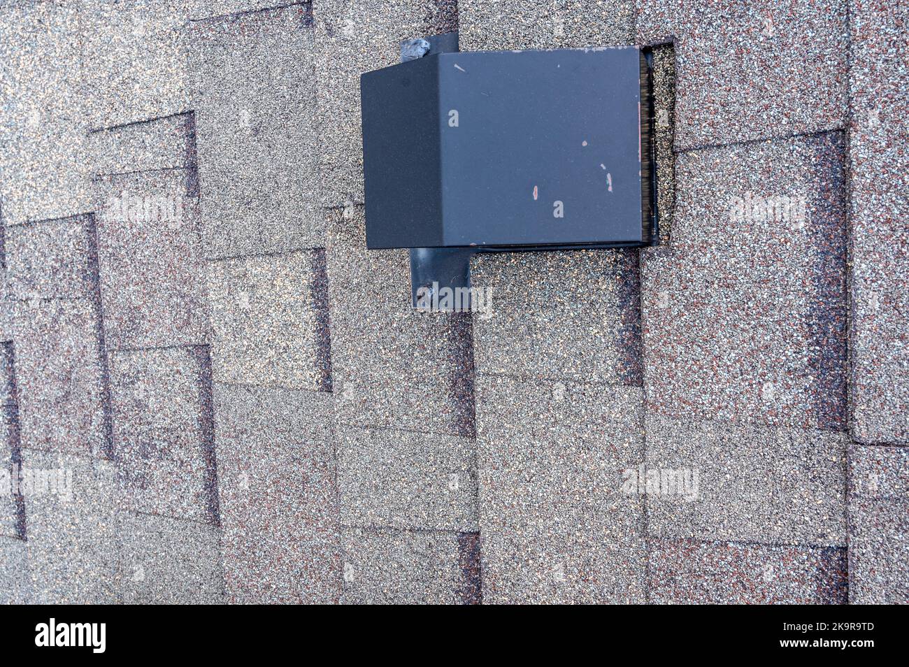 Static vent installed on a shingle roof for passive attic ventilation