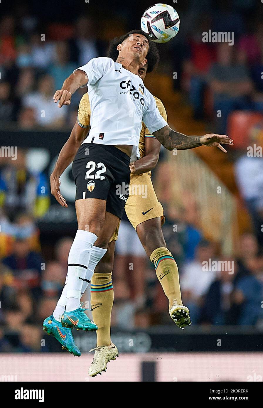 (221030) -- VALENCIA, Oct. 30, 2022 (Xinhua) -- Jules Kounde (back) of FC Barcelona vies with Marcos Andre of Valencia FC during their La Liga football match in Valencia, Spain, Oct. 29, 2022. (Str/Xinhua) Credit: Xinhua/Alamy Live News Stock Photo